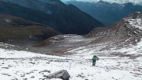 Traversing the broad scree ramp back climber's right