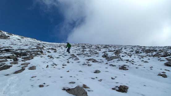 Carefully descending the slippery upper slope