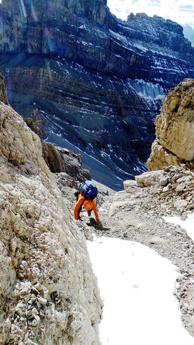 Starting up an obvious gully while hoping for the best.