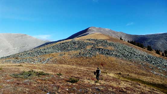 Ben hiking up typical terrain.