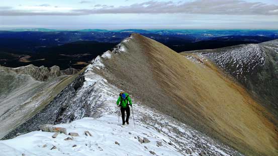 Vern ascending towards the true summit, with false summit behind