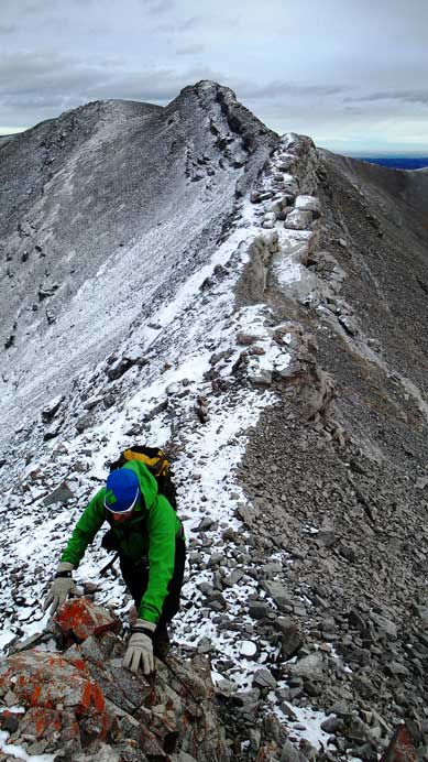 Vern ascending a step, with the spine in the background.