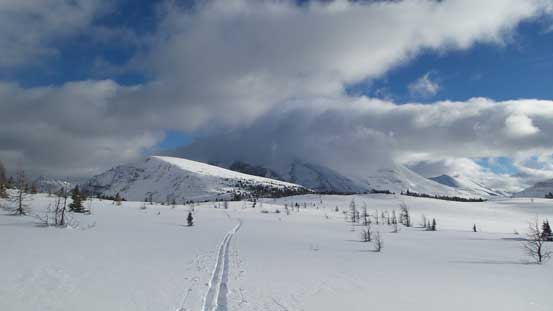 Looking back. Our objective is the small peak in foreground