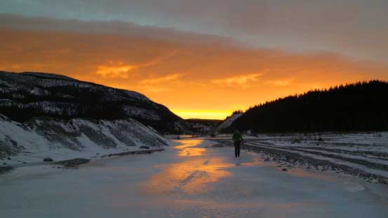 Vern walking on the ice river. Note the reflection on ice.