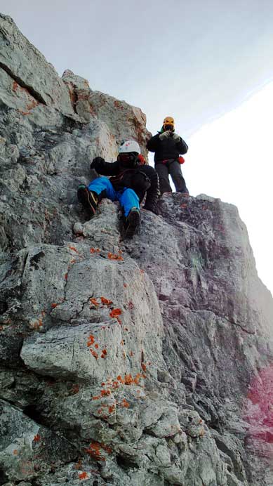 Ben and Vern scrambling down from the summit nipple
