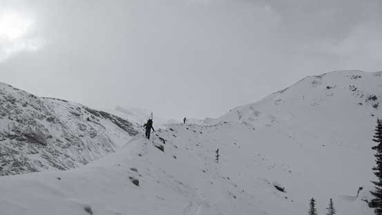 Skis on our packs now. Ascending tediously up the moraine...