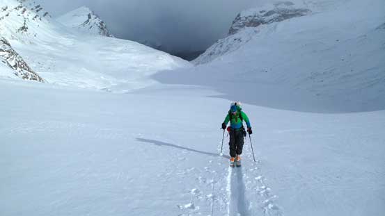 Vern slogging up Peyto Glacier with some bad weather behind