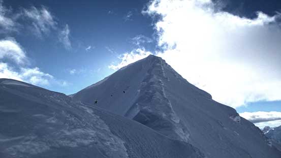 The heavily corniced upper ridge
