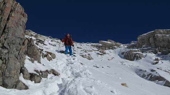 Ben descending the slippery terrain just above where to ditched skis