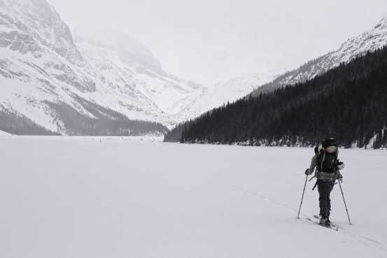Skinning across Peyto Lake in marginal weather. Photo by Ben