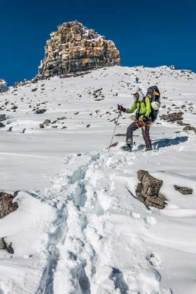 Me descending with the summit nipple behind. Photo by Vern