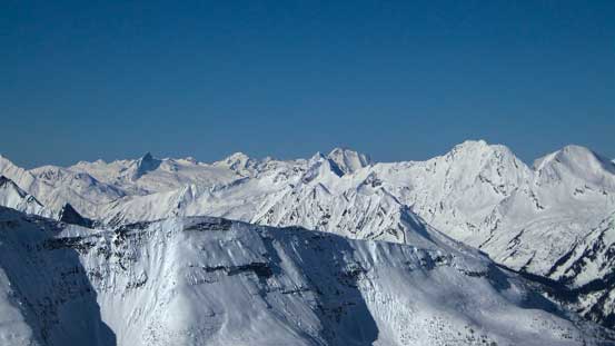 Many peaks in the Selkirks are visible including Fang Rock group