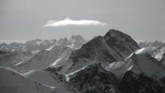 Howser Towers rise behind Chancellor Peak on its left shoulder