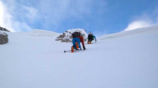 Now, time to drop down the south face. Steep snow climb initially
