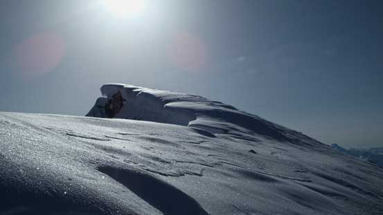 The last bit to the summit is heavily corniced