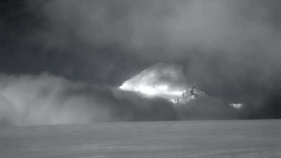 The face of Mt. Columbia trying to sneak out in the intermittent clouds