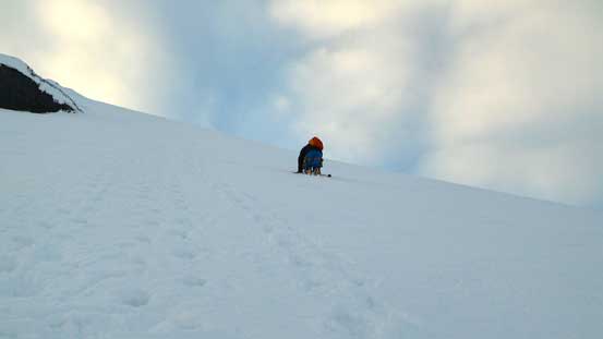 Looking back at Ben down-climbing the Face