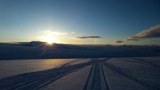 Gorgeous sunrise over Mt. Andromeda. Note the snowmobile tracks...