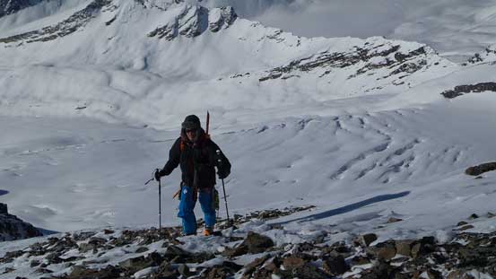 Ben ascending the S. Ridge of McDonell with the broken Simon Glacier behind
