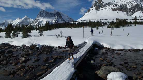Ben carefully skiing across this skinny bridge