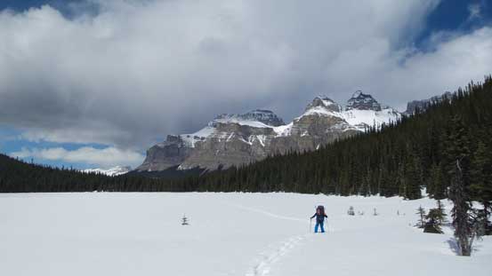 Snowshoeing across Epaulette Lake with Mt. Murchison behind