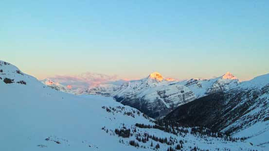 Alpenglow on Forbes and Outram over the horizon