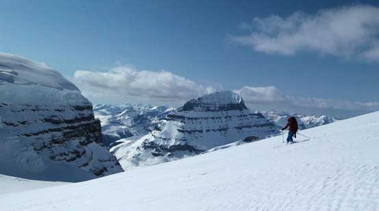 Ben skiing down Stutfield NE2, with Mt. Alberta in the background