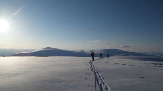 Ben, Vern and Kevin skiing over the 3300-meter rounded bump