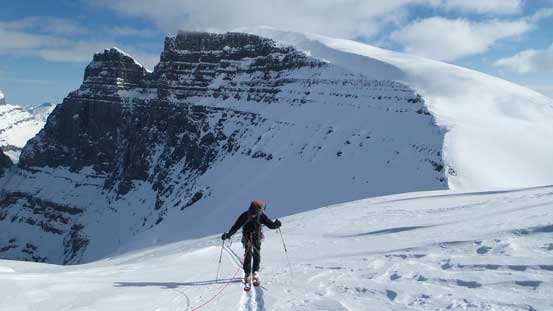 Kevin skiing to the rocky platform before ditching skis