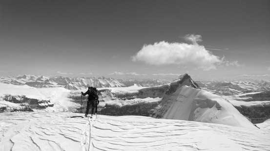 Ben and Kevin skiing up North Twin, with Columbia and South Twin behind
