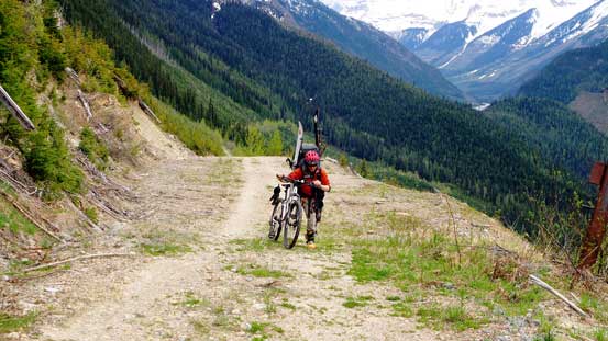 Soon we had to start pushing the bikes. Note the skis and ski boots...