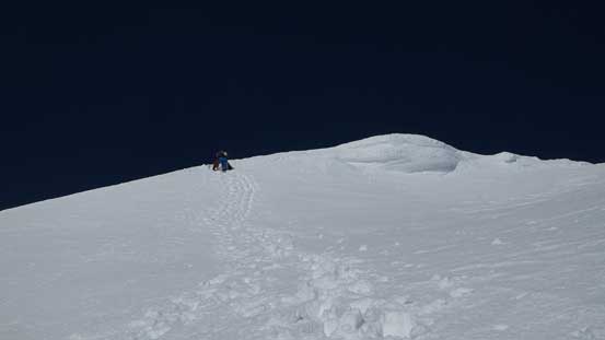 Starting the long down-climb. Firstly we had to drop down that summit cornice