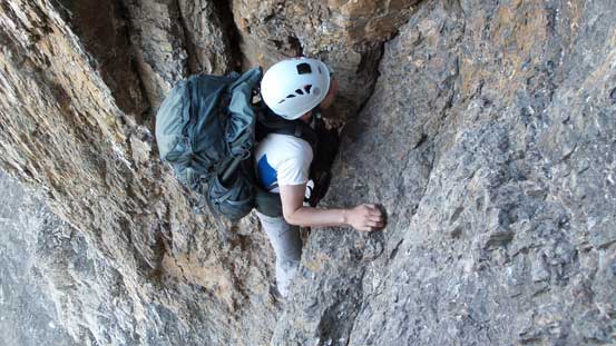 Ben climbing up the 5.4 chimney to gain the Dragon's Back
