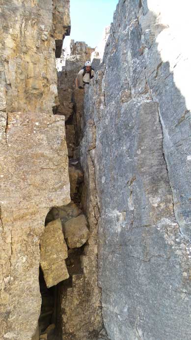 Ben down-climbing into the notch