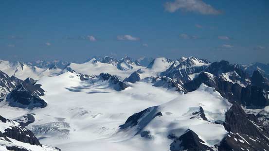 Peaks on Freshfield Icefield rise behind peaks on Mons Icefield