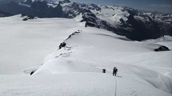 Ben and Vern ascending onto the false summit after a 40-degree snow climb
