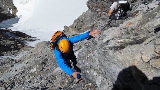 Ferenc scrambling up the typical loose terrain