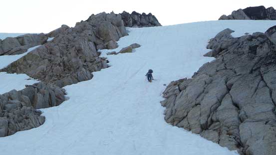 Eric down-climbing steep snow. It's also possible to use the rock rib on left