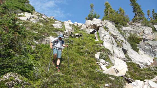 Eric descending steep grassy slopes just below our camp