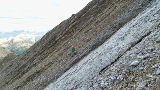 Vern picking a line up the steep scree to regain the ridge