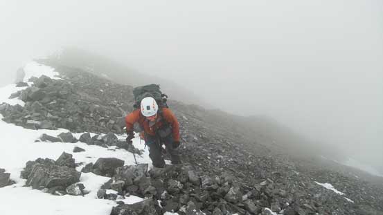 Ben ascending the last few meters to the false summit
