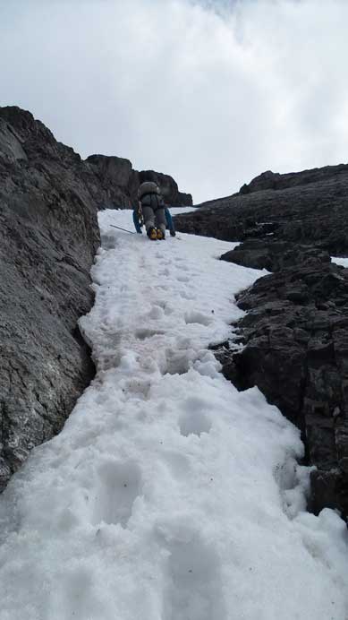 Vern down-climbing steep snow
