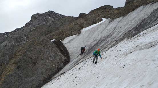 Ben down-climbing ice while Vern transitioning back on snow. 