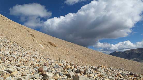 Onto the SW Face. Oh the treadmill scree.....