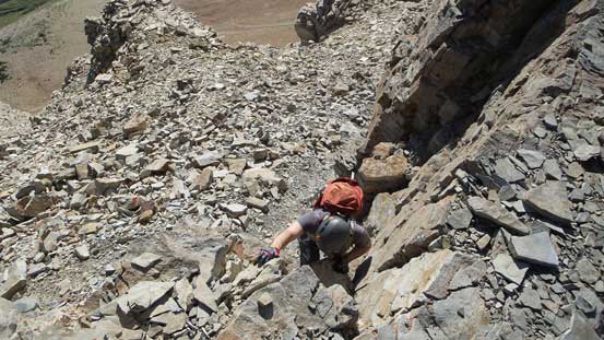 Mike scrambling through the final cliff band