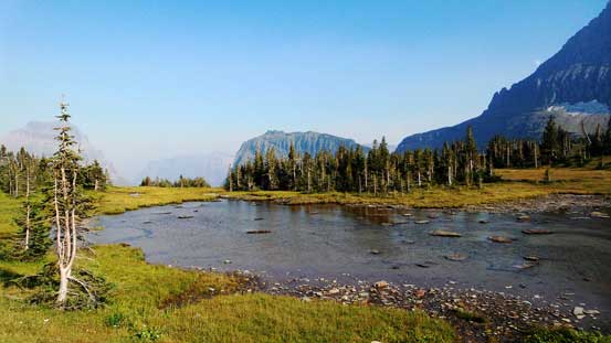 A pond at the trail junction. Behind is the tip of Heavy Runner Mountain