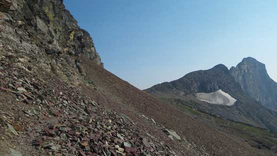 Traversing scree on a goat path around the W. side of Reynolds