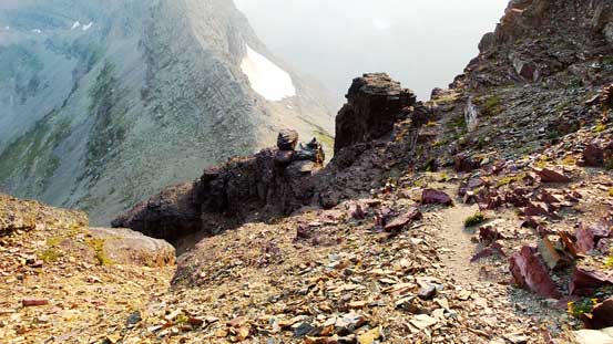 Partway down the lower face.