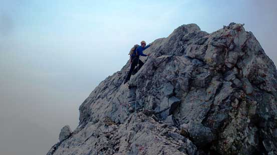 Maury down-climbing/traversing the crux slab (5.5)