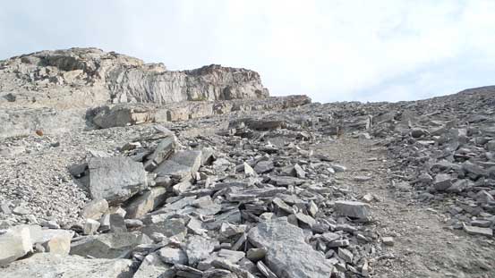 Slabs covered by loose rocks...